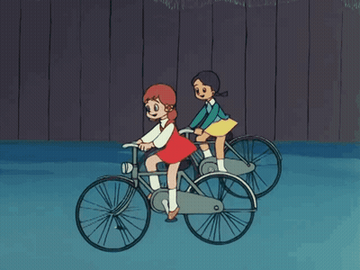 Two Girls Riding Bicycles GIF