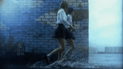 Two Girls Running Through Puddle GIF