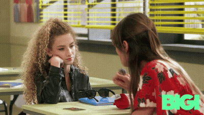 Two Girls Sitting At Desk In Front Of Window Big GIF