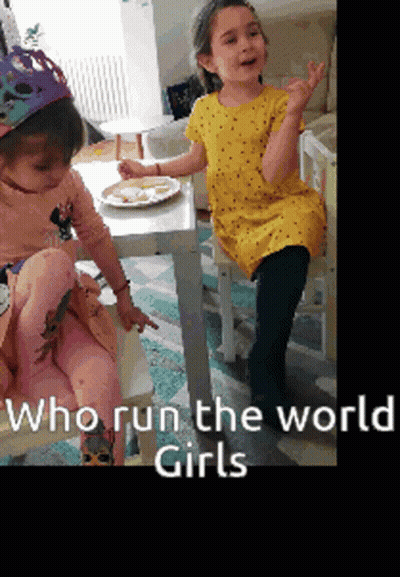 Two Girls Sitting At Table With Who Run The World Girls GIF