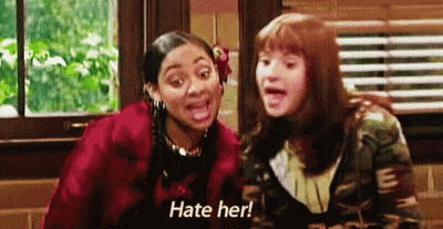 Two Girls Sitting Together Saying Hate Her GIF