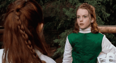 Two Girls Standing Next To Each Other GIF