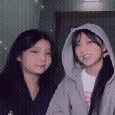 Two Girls Standing One In Hoodie GIF