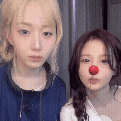 Two Girls Standing One With Red Nose GIF