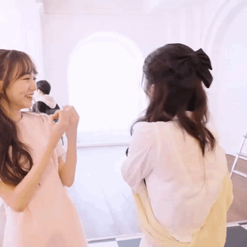 Two Girls Standing Together GIF