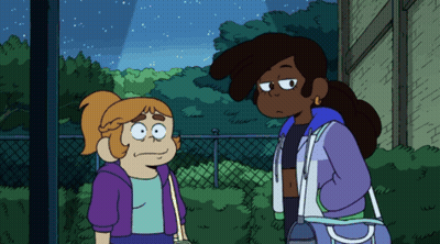 Two Girls Standing Together, One In Purple Jacket GIF