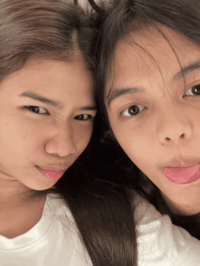 Two Girls Sticking Their Tongues Out And Making Faces GIF