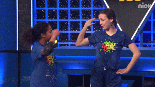 Two Girls Wearing Blue Double Dare Shirts Are Giving Each Other A High Five GIF