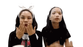 Two Girls Wearing Face Masks And Headband Sticker