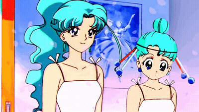Two Girls With Blue Hair Are Standing In Front Of A Picture GIF