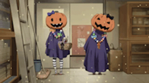 Two Girls With Pumpkins On Their Heads Stand In A Hallway GIF