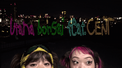 Two Girls With Sign Utah Bonsai Flat Cent GIF
