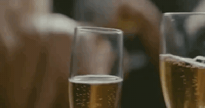 Two Glasses Of Champagne Being Poured GIF
