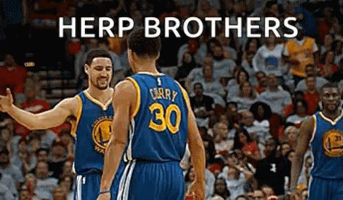 Two Golden State Warriors Basketball Players Are Standing Next To Each Other On The Court . GIF
