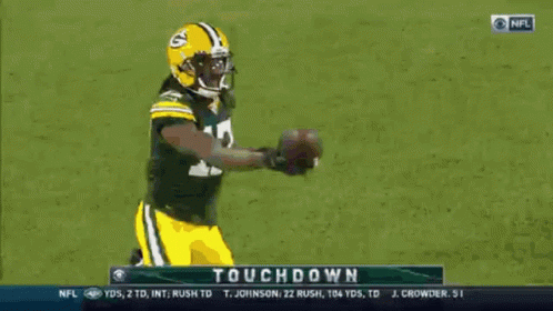 Two Green Bay Packers Players Celebrate A Touchdown During A Football Game GIF