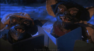 Two Gremlins Singing Ya-Ya-Ya In Dark Room GIF