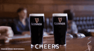 Two Guinness Glasses With Cheers GIF
