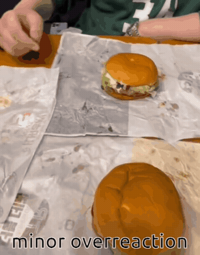 Two Hamburgers On A Table With The Words Minor Overreaction GIF