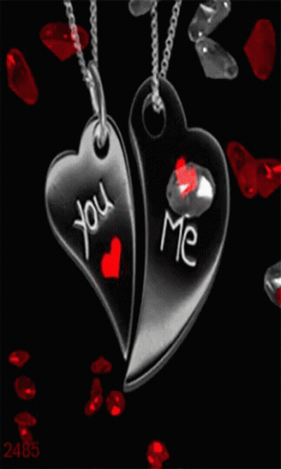 Two Heart Shaped Pendants With The Words You And Me Written On Them GIF