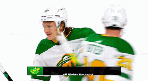 Two Hockey Players Are Standing Next To Each Other With The Words All Rights Reserved In The Upper Right Corner GIF