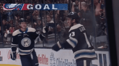 Two Hockey Players Celebrating Goal Banner GIF