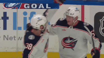 Two Hockey Players Celebrating Goal In Front Of Netw Ad GIF