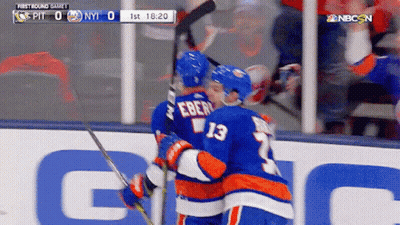 Two Hockey Players Hugging In Front Of Scoreboard Saying First Round Game 1 GIF