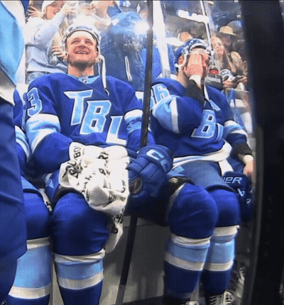 Two Hockey Players In Blue TBL Uniforms GIF