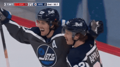 Two Hockey Players In Jets Jerseys Celebrating On Ice GIF