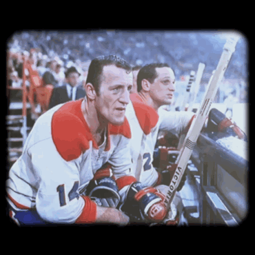 Two Hockey Players In Victoria Gloves In Stands GIF