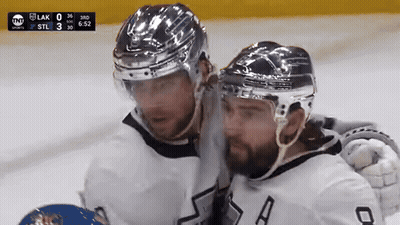 Two Hockey Players On Ice With TNT Scoreboard GIF