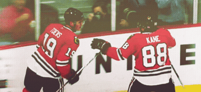 Two Hockey Players One Of Whom Has The Number 88 On His Back GIF