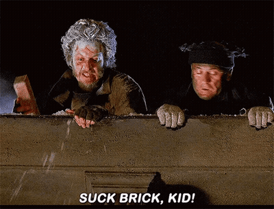 Two Homeless Men Looking Over Wall Suck Brick Kid GIF