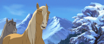 Two Horses Standing In Front Of Snowy Mountains GIF