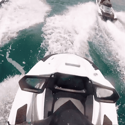 Two Jet Skis Are Going Through The Water And One Has The Word Yamaha On It GIF