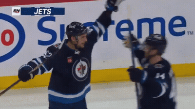 Two Jets Players Celebrate Goal In Front Of Supreme Ad GIF