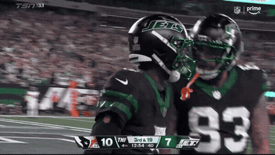 Two Jets Players Hugging On Field GIF