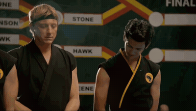 Two Karate Fighters In Front Of Scoreboard Saying Hawk GIF