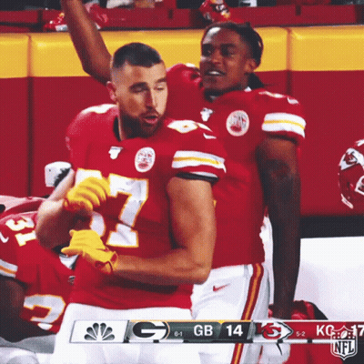 Two Kc Football Players Celebrate A Touchdown During A Game Against Gb GIF