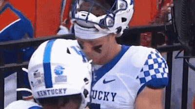 Two Kentucky Football Players Kissing GIF