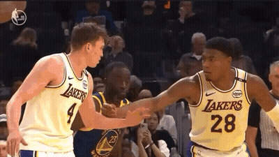 Two Lakers Basketball Players Shaking Hands GIF