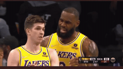 Two Lakers Basketball Players Standing GIF