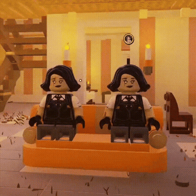 Two Lego Figures Are Sitting On A Orange Couch In A Room GIF