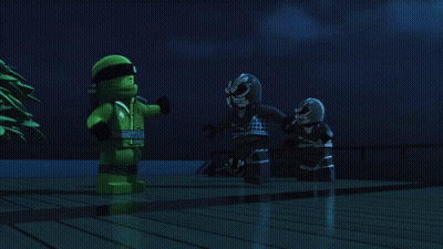 Two Lego Figures Are Standing Next To Each Other In The Dark GIF