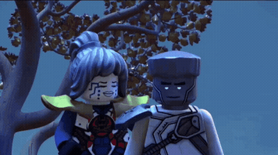 Two Lego Figures Beside Trees GIF