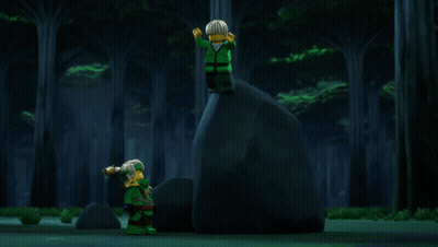 Two Lego Figures Hugging With Torch In Background GIF