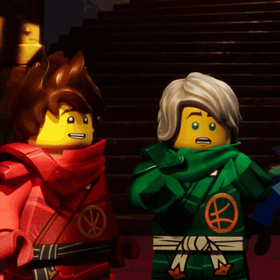 Two Lego Figures One In Green Outfit With Letter N GIF