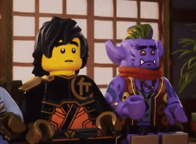 Two Lego Figures Sitting Next To Each Other GIF
