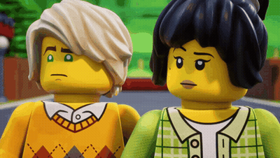 Two Lego Figures Standing Together GIF
