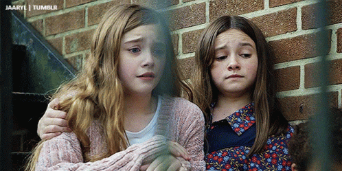 Two Little Girls Are Hugging Each Other In Front Of A Brick Wall And The Words Tumblr Are On The Bottom GIF